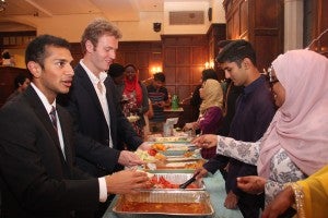 Students serve one another at our Eid banquet