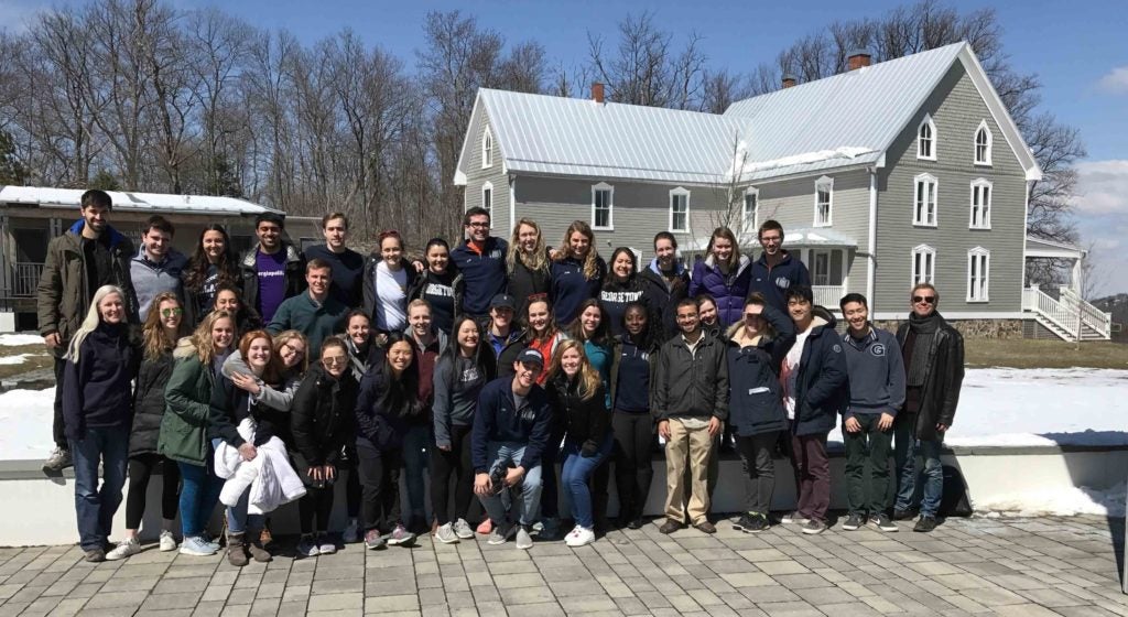 Student with Fr. Schenden and chaplain Michelle at the retreat center. 
