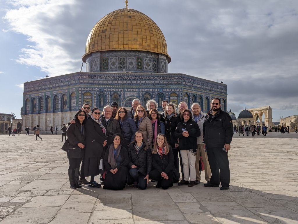 Faculty and staff standing outside the Al-Aqsa Mosque in Jerusalem