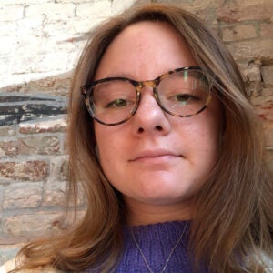 headshot of a woman wearing glasses