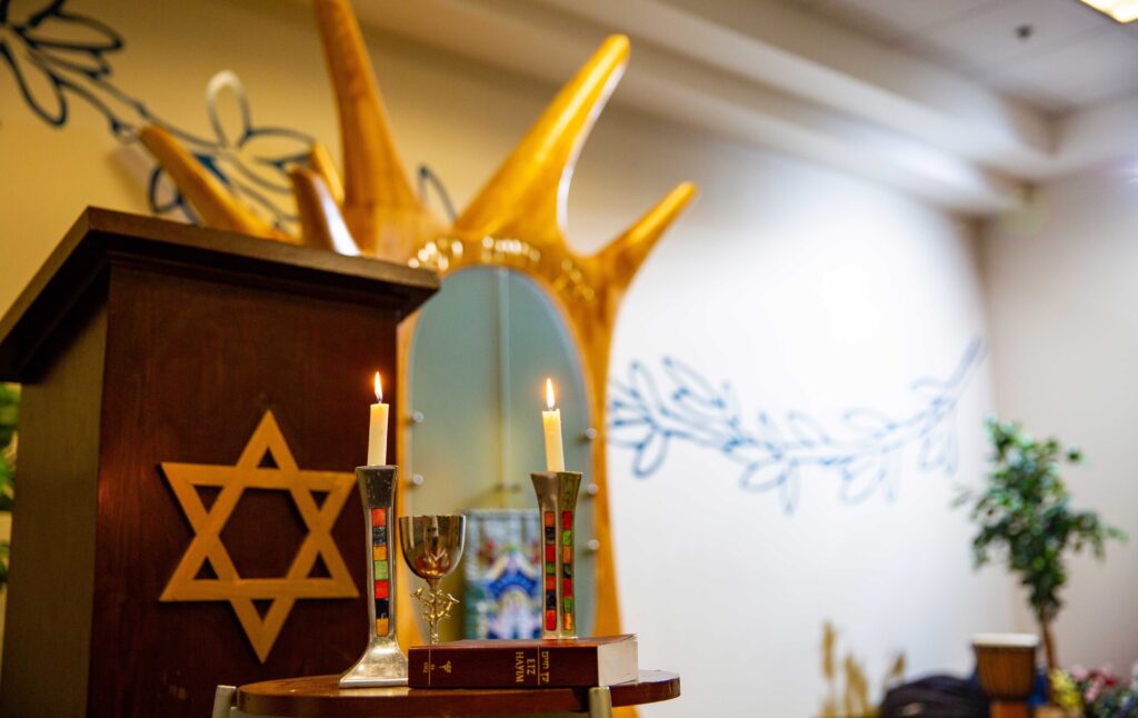 Jewish community space with arc and candles
