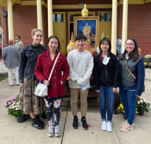 Students standing in front of Wat Yarnna Rangsee Buddhist Monastery in Sterling, Virginia 