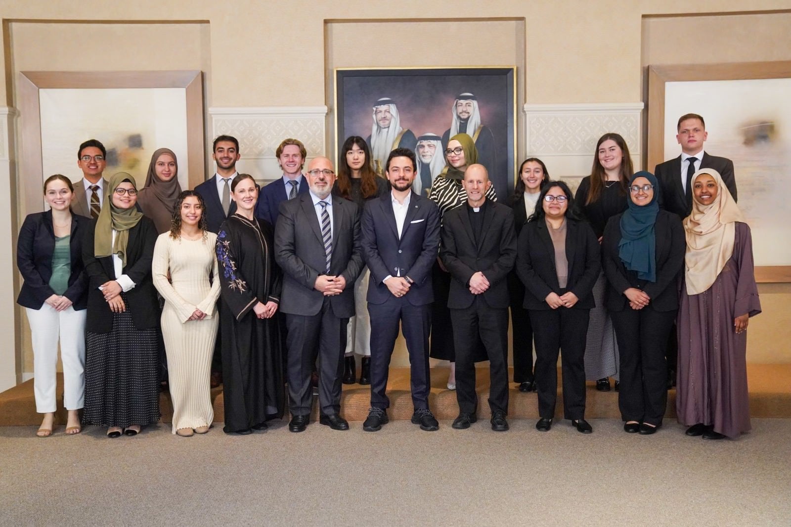 His Royal Highness Crown Prince Al Hussein bin Abdullah II standing in the center between Fr. Matthew Carnes, Imam Yahya Hendi, and a group of students.