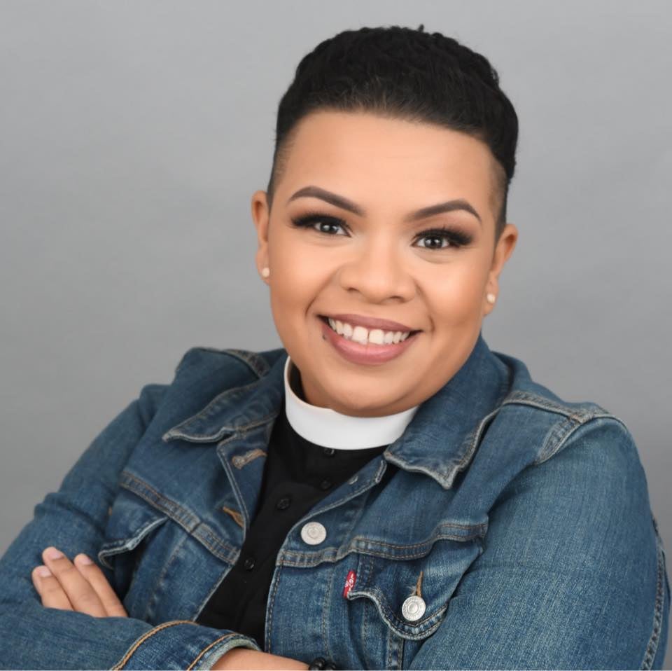 a headshot of Rev. Dr. Shazetta Thompson-Hill. She is wearing a clerical collar and denim jacket.
