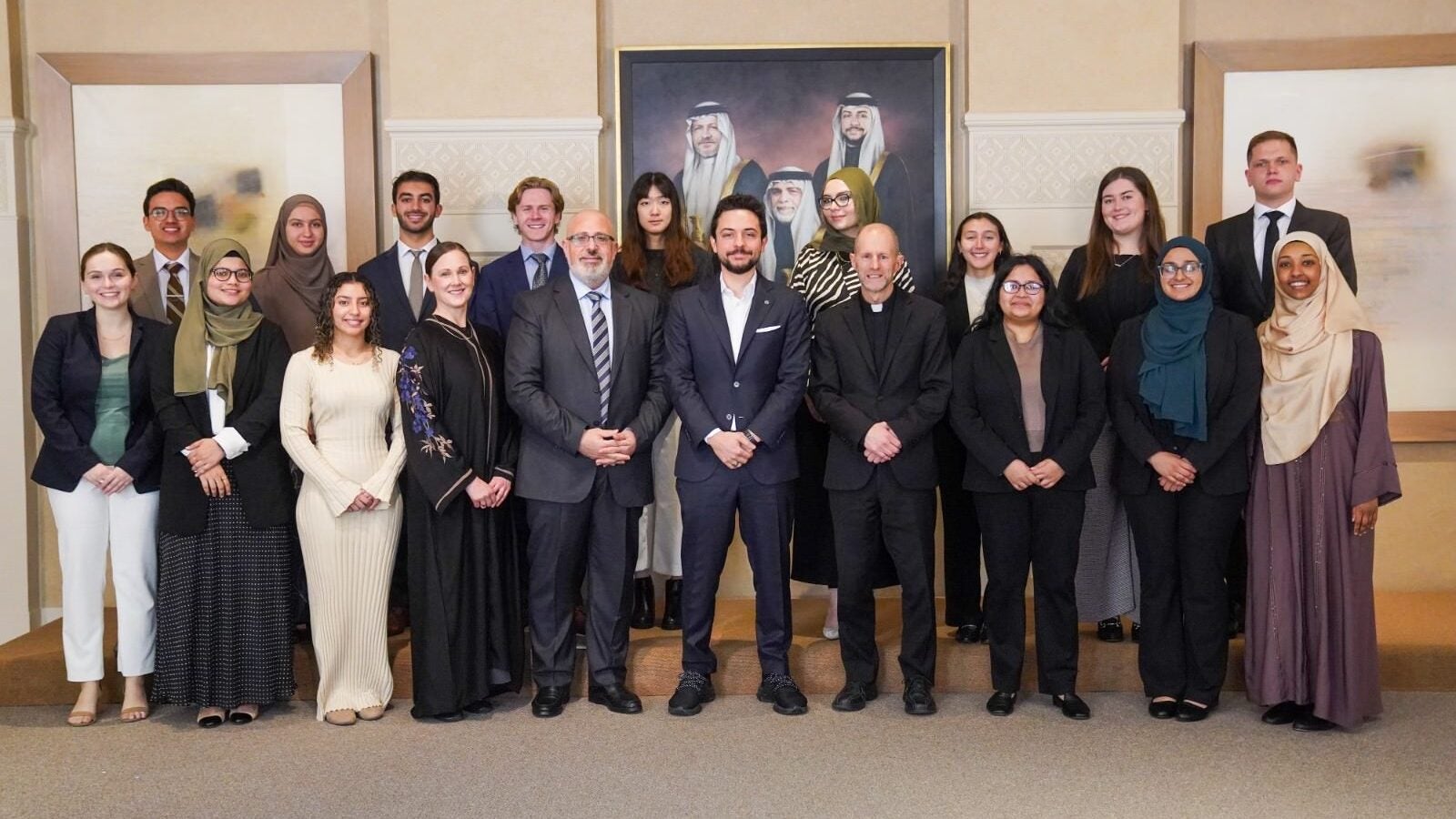 His Royal Highness Crown Prince Al Hussein bin Abdullah II standing in the center between Fr. Matthew Carnes, Imam Yahya Hendi, and a group of students.