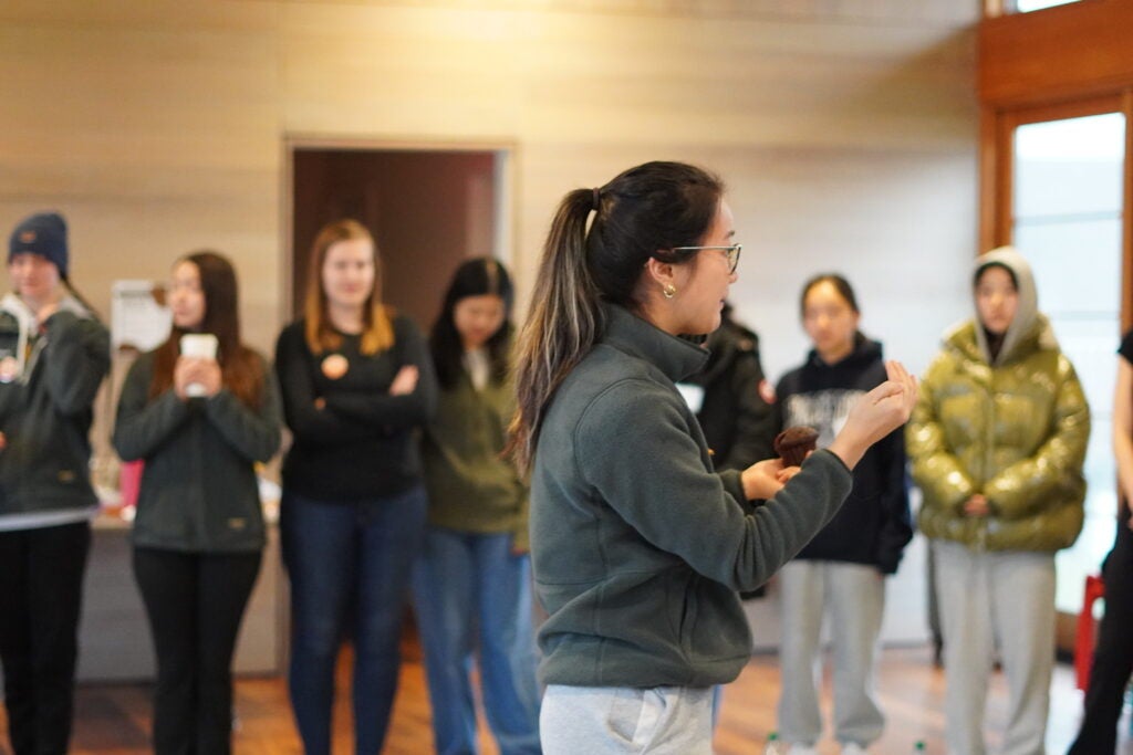Alice Chen leading a group of students at ESCAPE during an activity