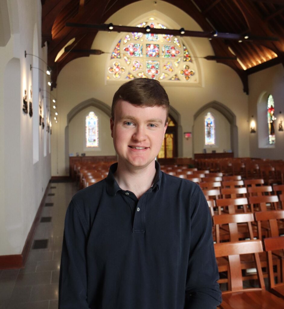 Headshot of Connor Coyle (SFS '24) in Dahlgren Chapel of the Sacred Heart