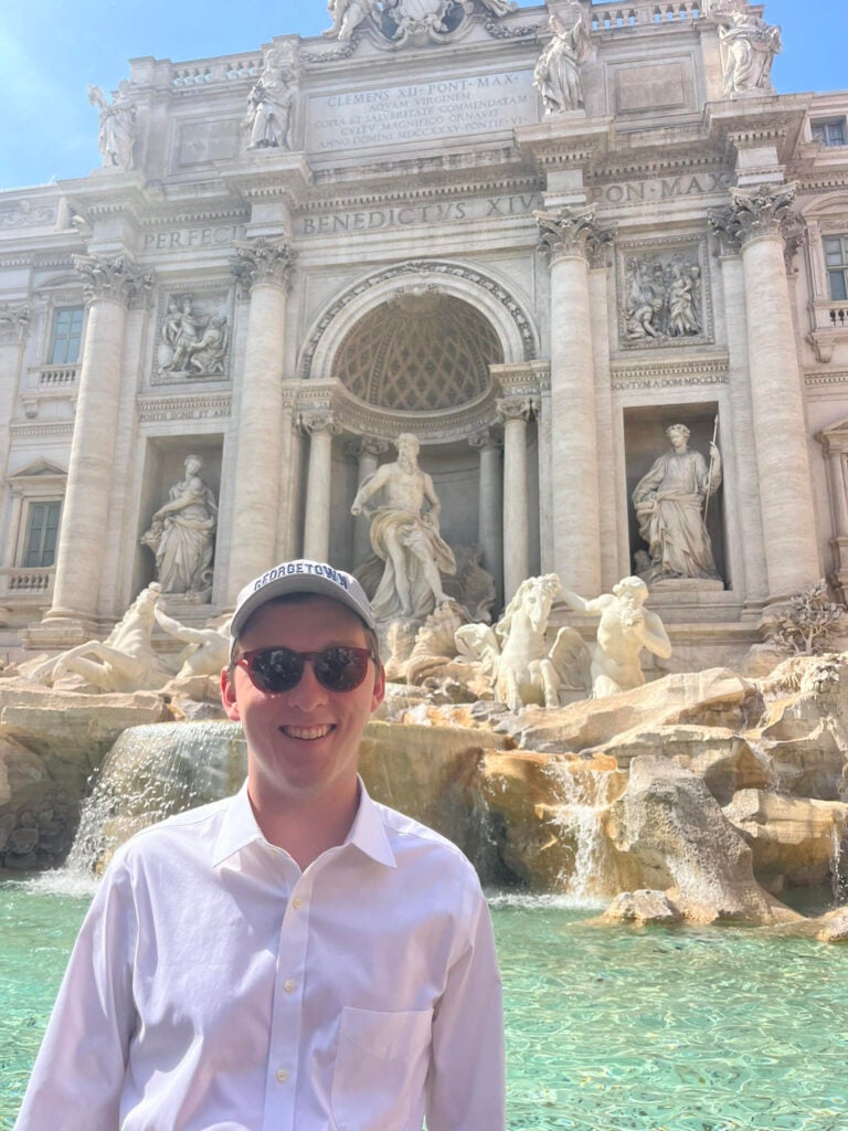 Headshot of Connor Hartigan with the Trevi Fountain in the background