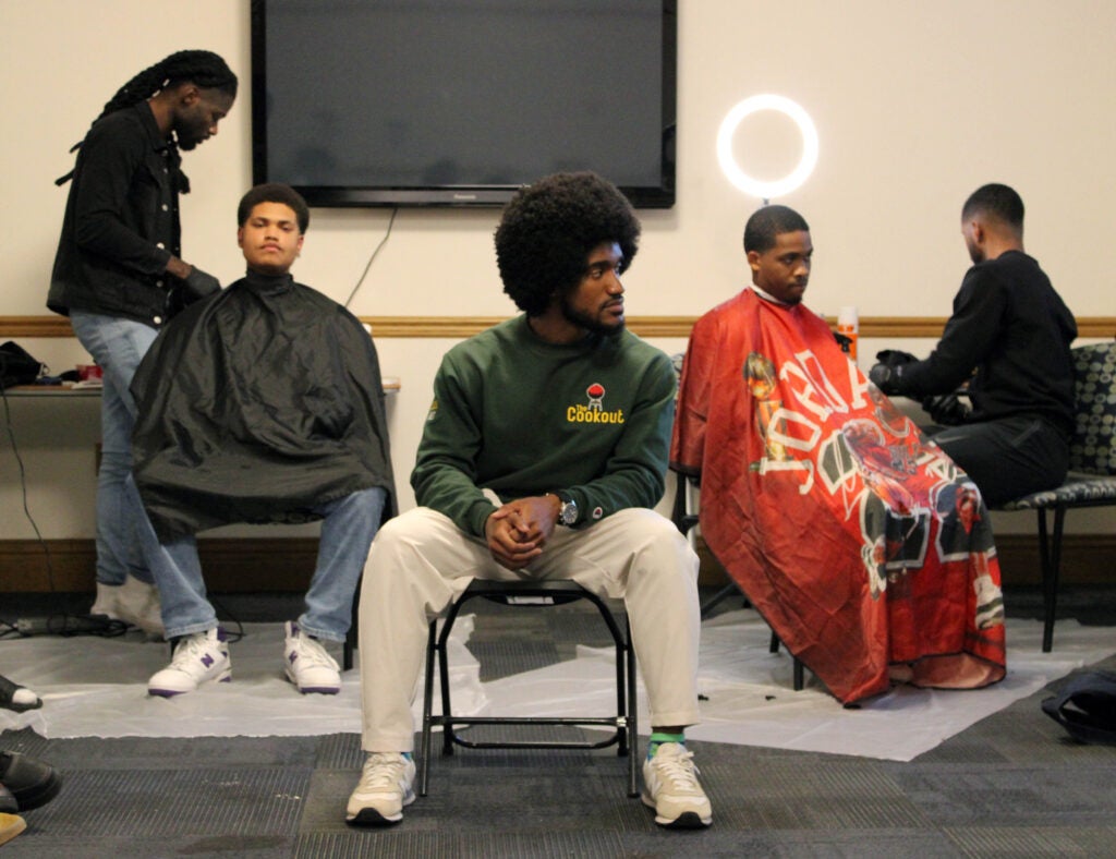 Student sitting in the hot seat during the Chop it Up event