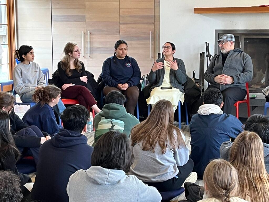 Saara Bidiwala (C’26), first from left, and Claire Auslander (N’26), second from left, sit on a panel at the 2025 Interfaith Retreat. 