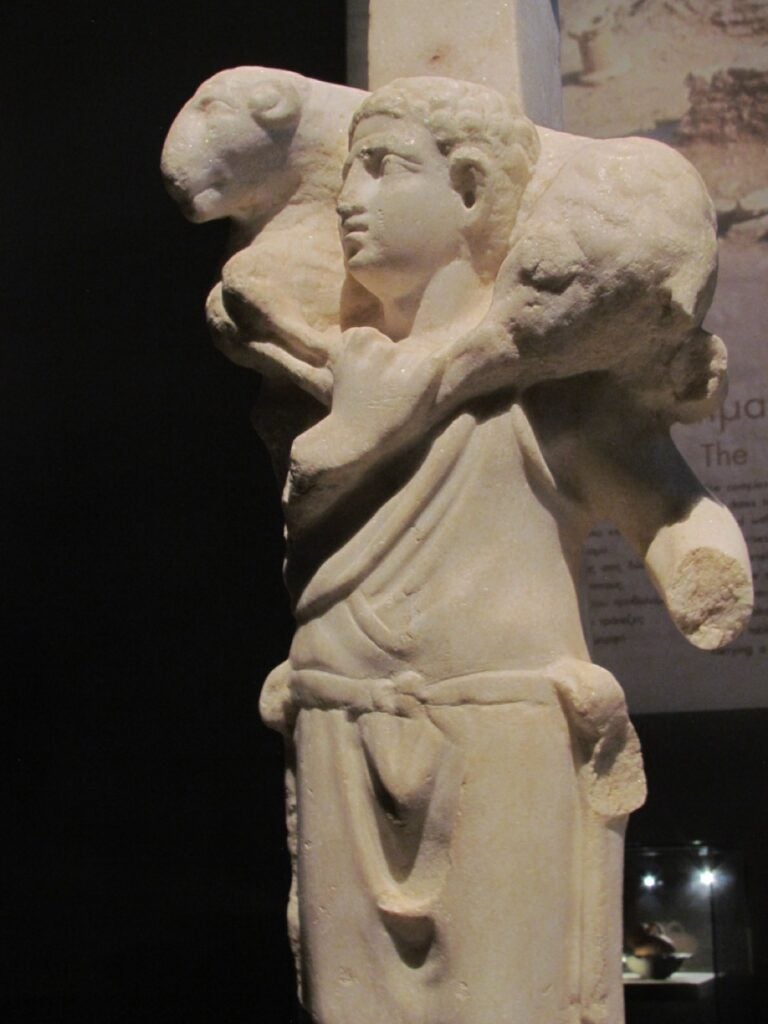 Statue of a young boy carrying a sacrificial lamb