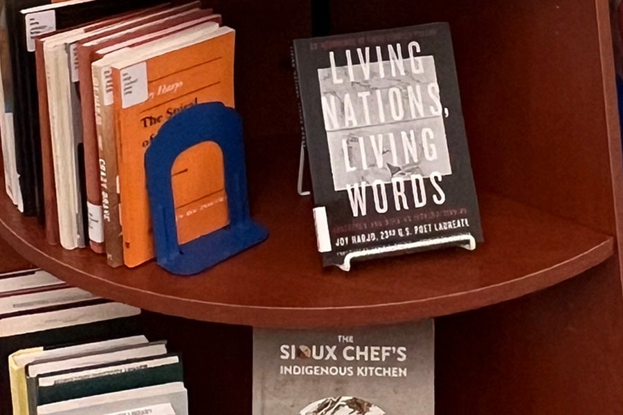 a shelf with books by indigenous authors on display