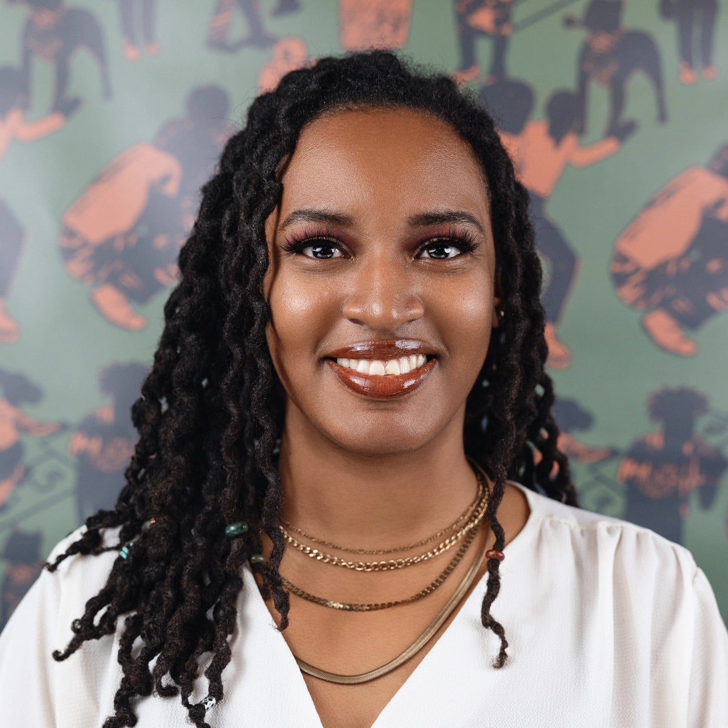 A Black woman with shoulder length hair. 